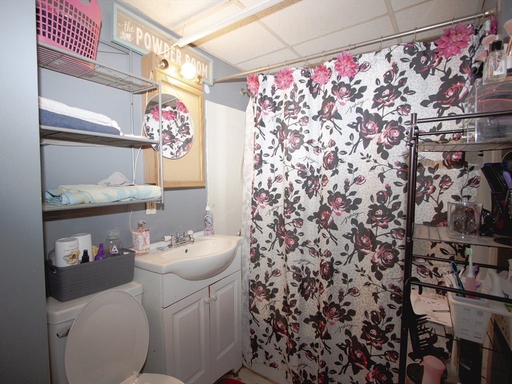 66 Cutler Street Worcester, MA 01604 - Photo 21 of 27 a bathroom with a sink toilet and vanity