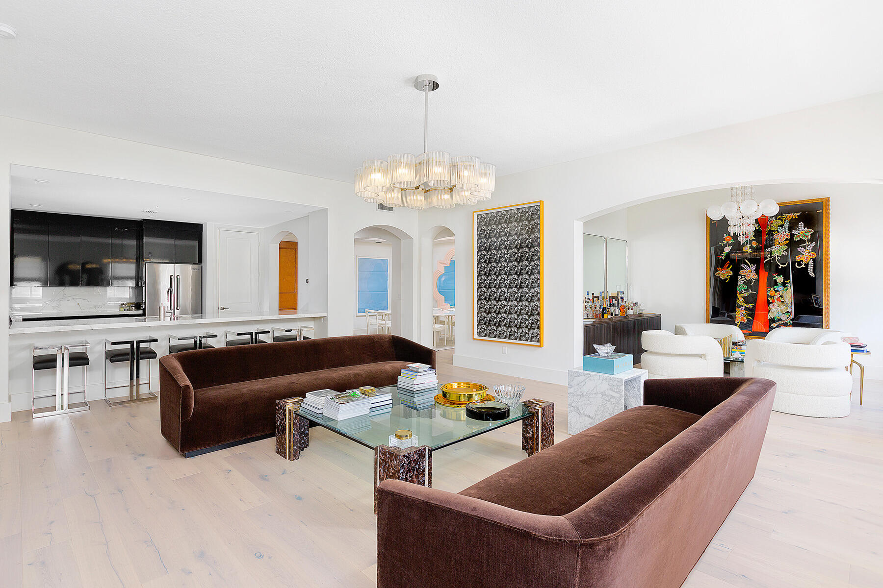 a living room with furniture and a chandelier