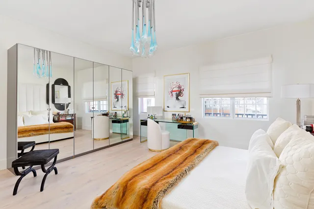 a bedroom with furniture and a window