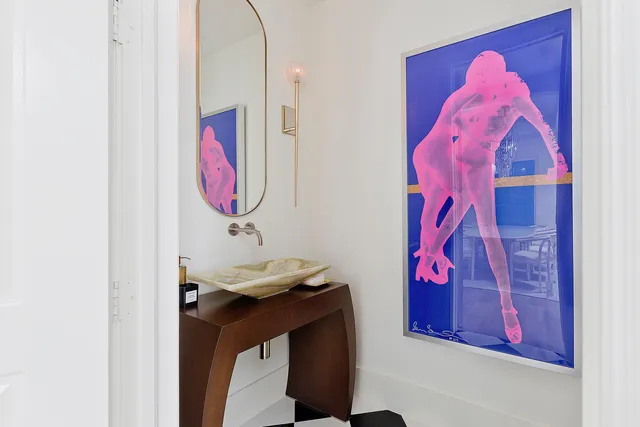 a bathroom with a mirror and a sink