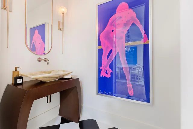 a bathroom with a sink and mirror