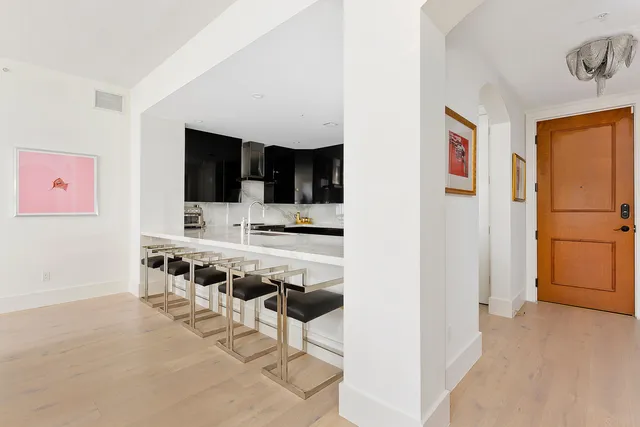 a view of kitchen with microwave and cabinets