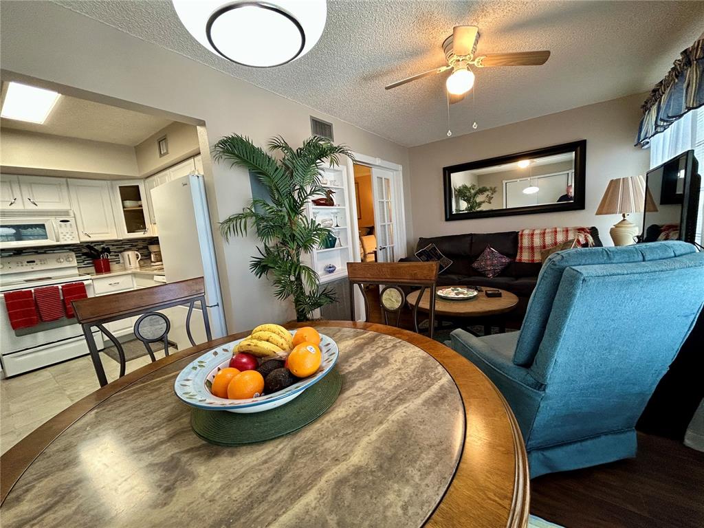 2260 Costa Rican Drive, Unit 50 Clearwater, FL 33763 - Photo 14 of 48 a living room with furniture and a flat screen tv