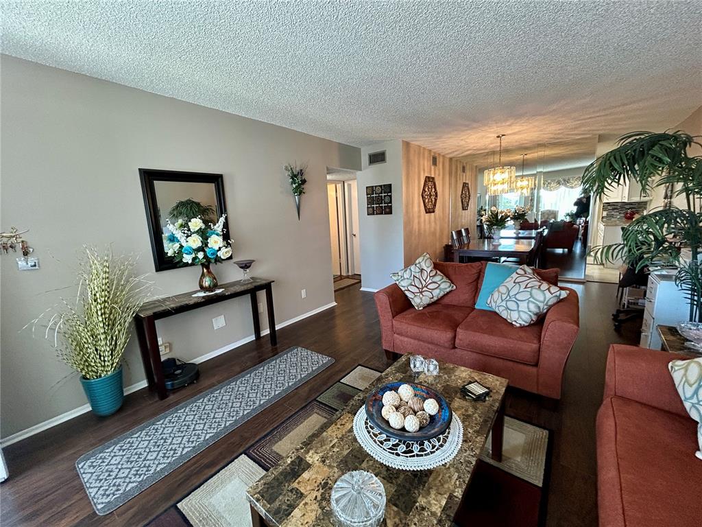 2260 Costa Rican Drive, Unit 50 Clearwater, FL 33763 - Photo 4 of 48 a living room with furniture and a dining table