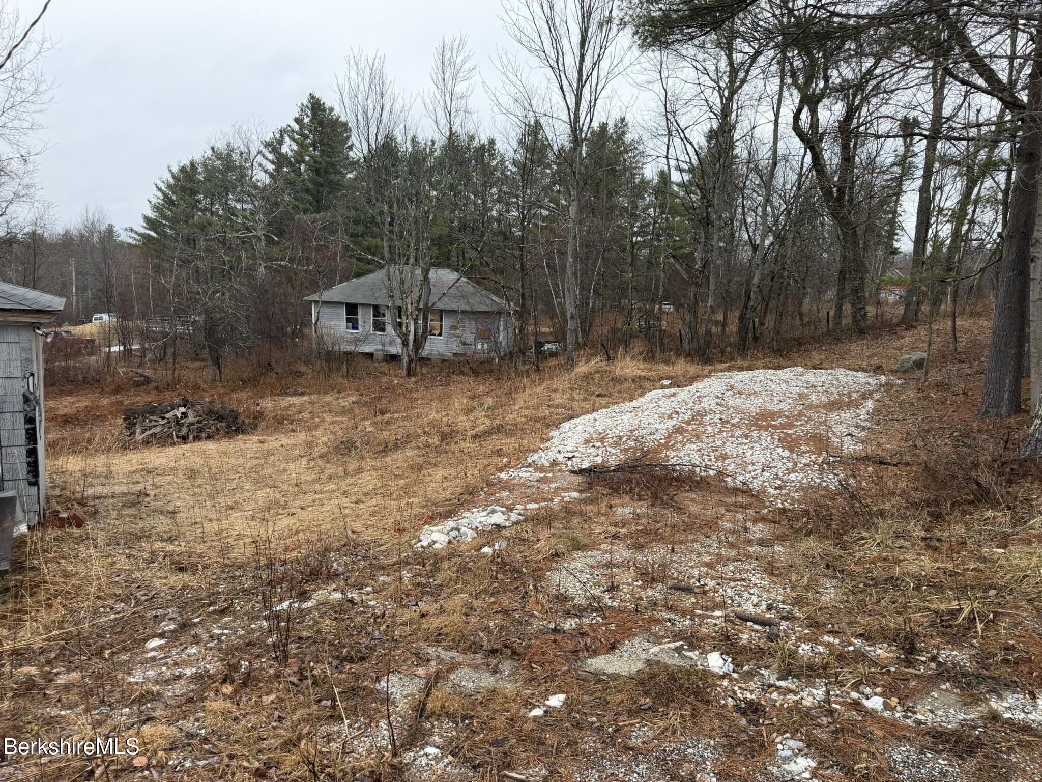 43 Access Road 4 Windsor, MA 01070 - Photo 10 of 10 a backyard of a house with trees and outdoor space