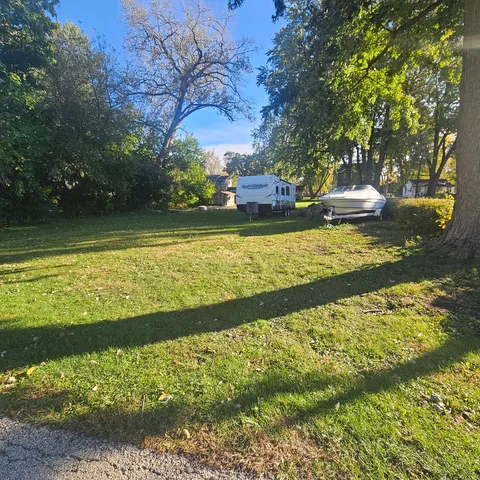 a view of a fountain with a yard
