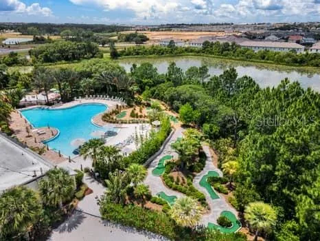 an aerial view of a houses with outdoor space and lake view