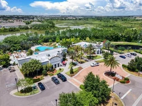 an aerial view of residential houses and outdoor space