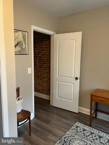 a view of a livingroom with wooden floor and closet