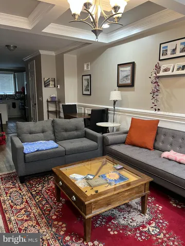 a living room with furniture and a rug