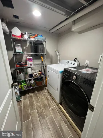 a living room with a couch and a rug