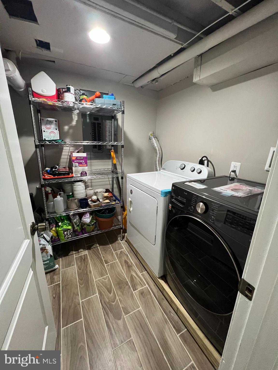 3319 Noble Street Baltimore, MD 21224 - Photo 30 of 31 a utility room with dryer washer and a view of living