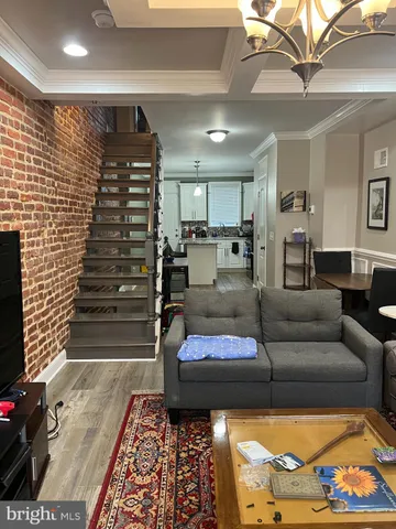 a living room with furniture and a rug