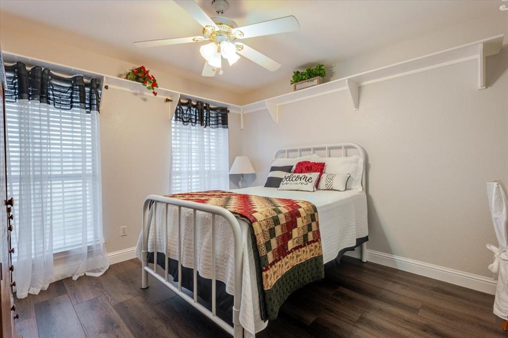 2400 Springfield Road Springtown, TX 76082 - Photo 18 of 31 Secondary bedroom with built in shelving and a desk