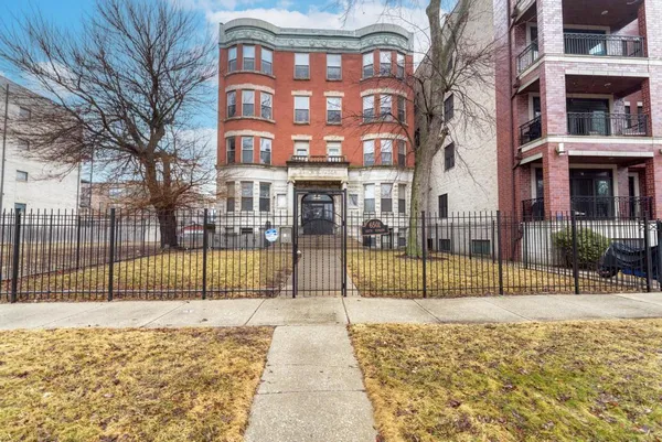 a view of a brick building with a pathway