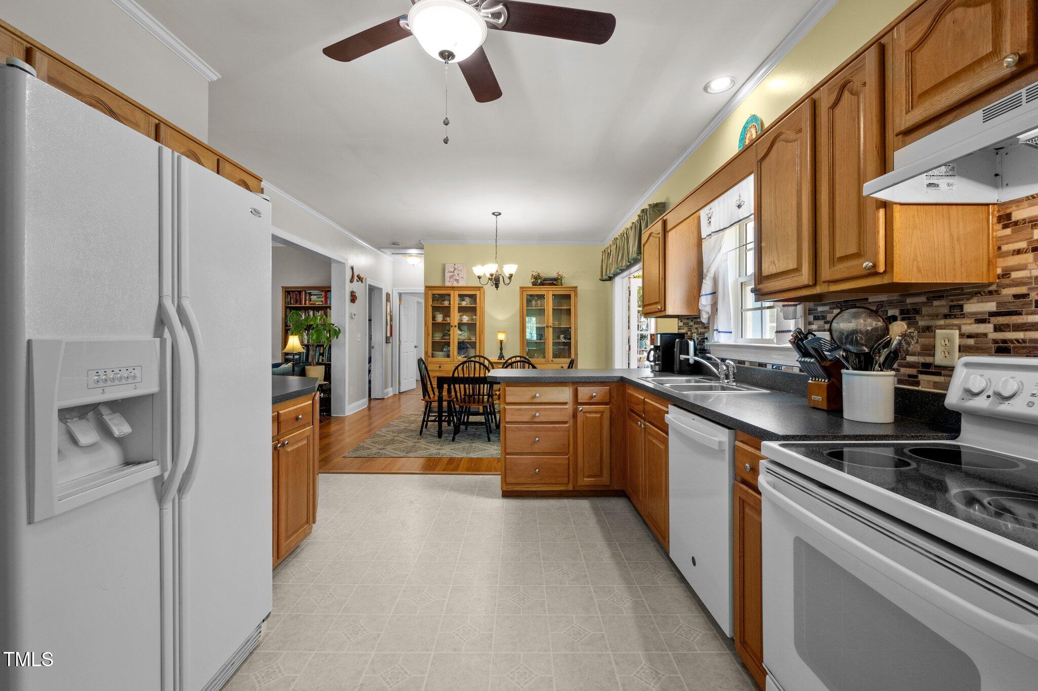 5013 West Pool Road Rougemont, NC 27572 - Photo 11 of 34 a kitchen with stainless steel appliances lots of counter top space cabinets and a center island