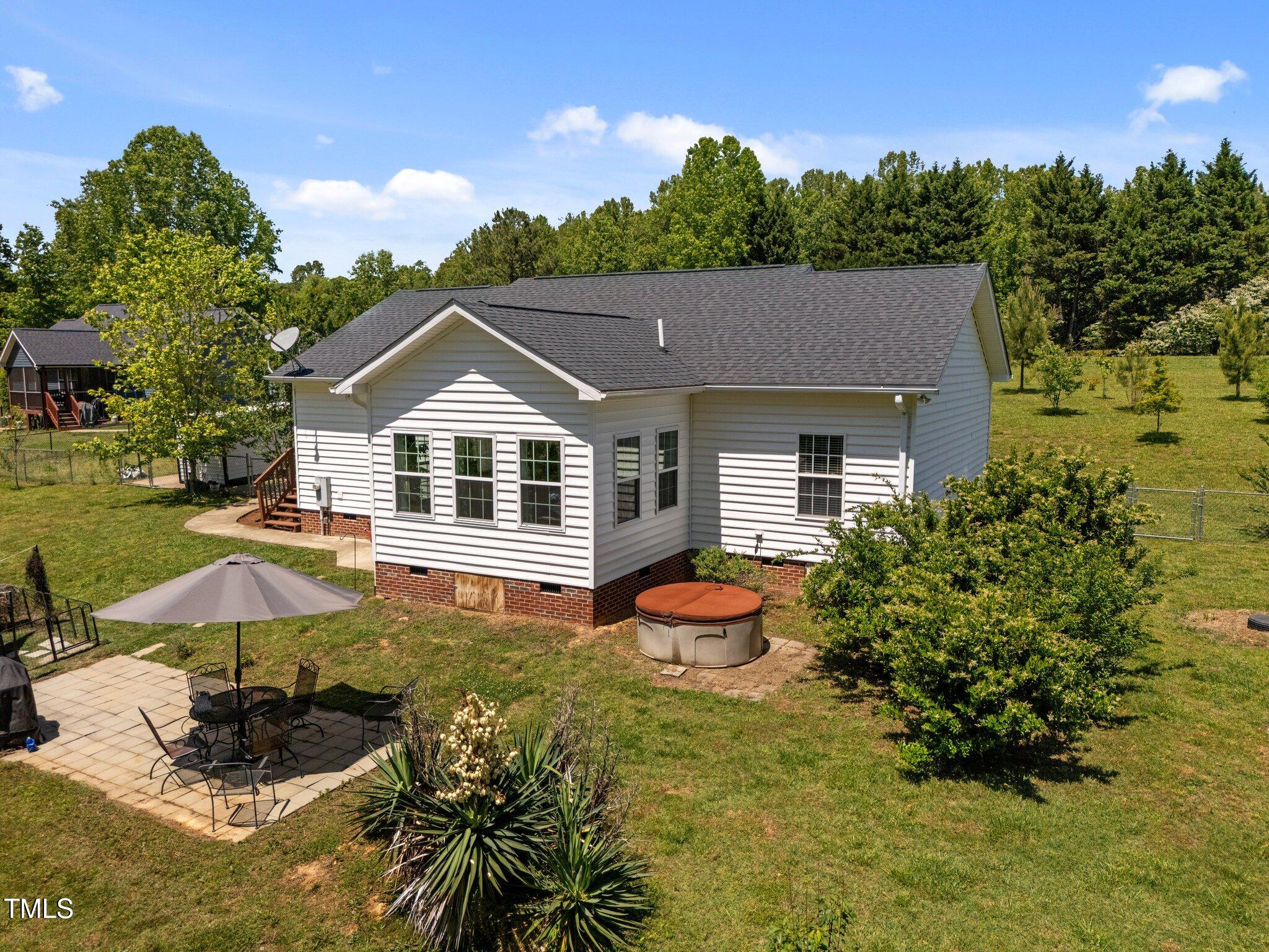 5013 West Pool Road Rougemont, NC 27572 - Photo 22 of 34 a front view of a house with a yard