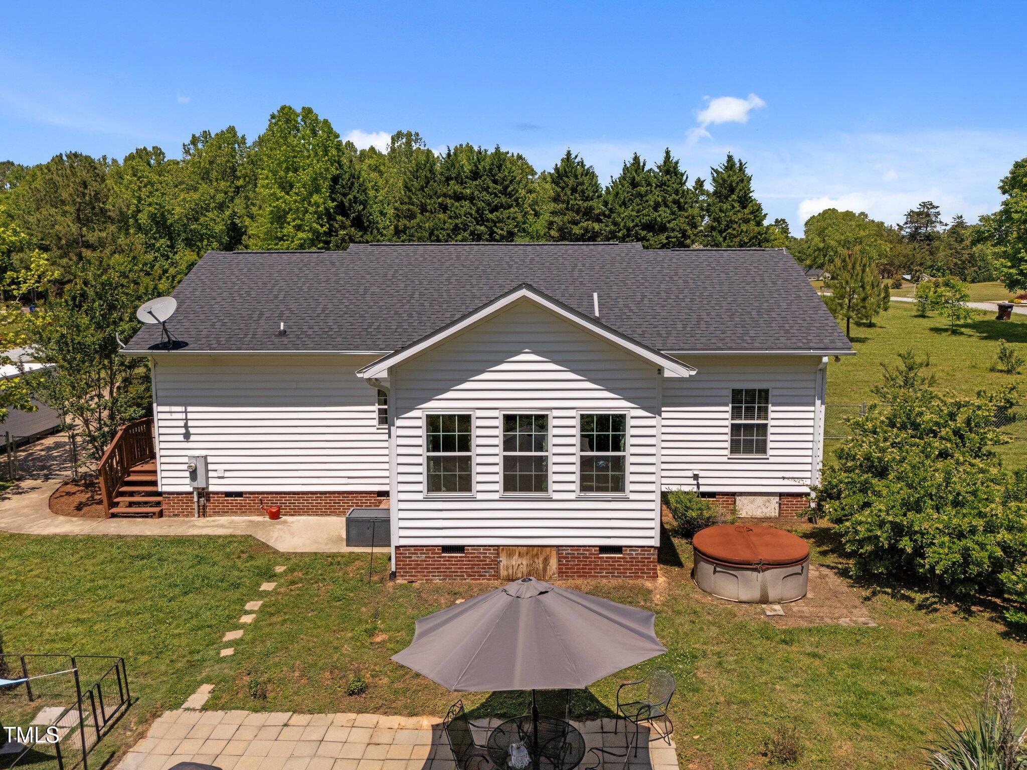 5013 West Pool Road Rougemont, NC 27572 - Photo 23 of 34 a aerial view of a house yard and swimming pool