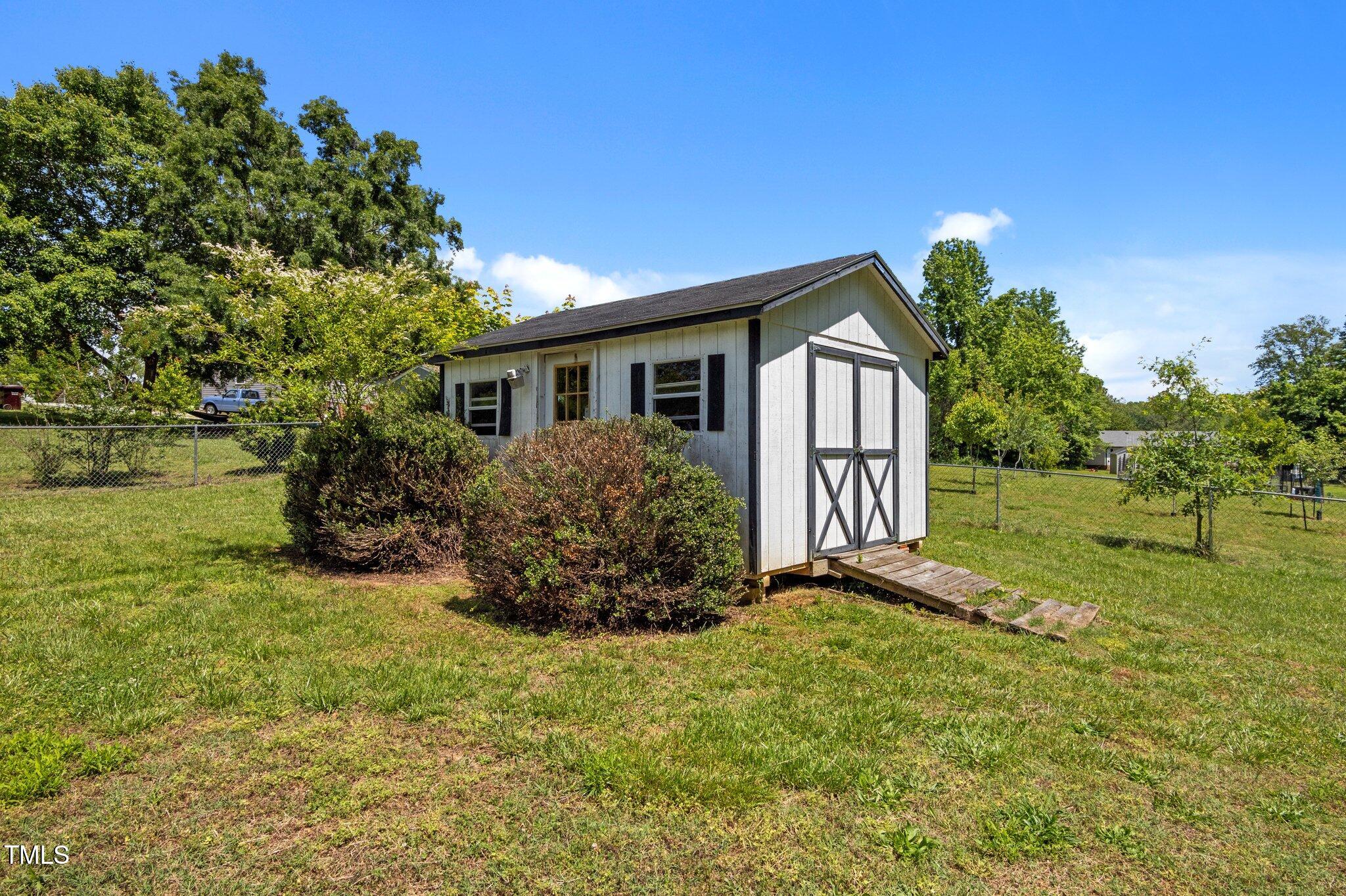 5013 West Pool Road Rougemont, NC 27572 - Photo 24 of 34 a house view with a garden space