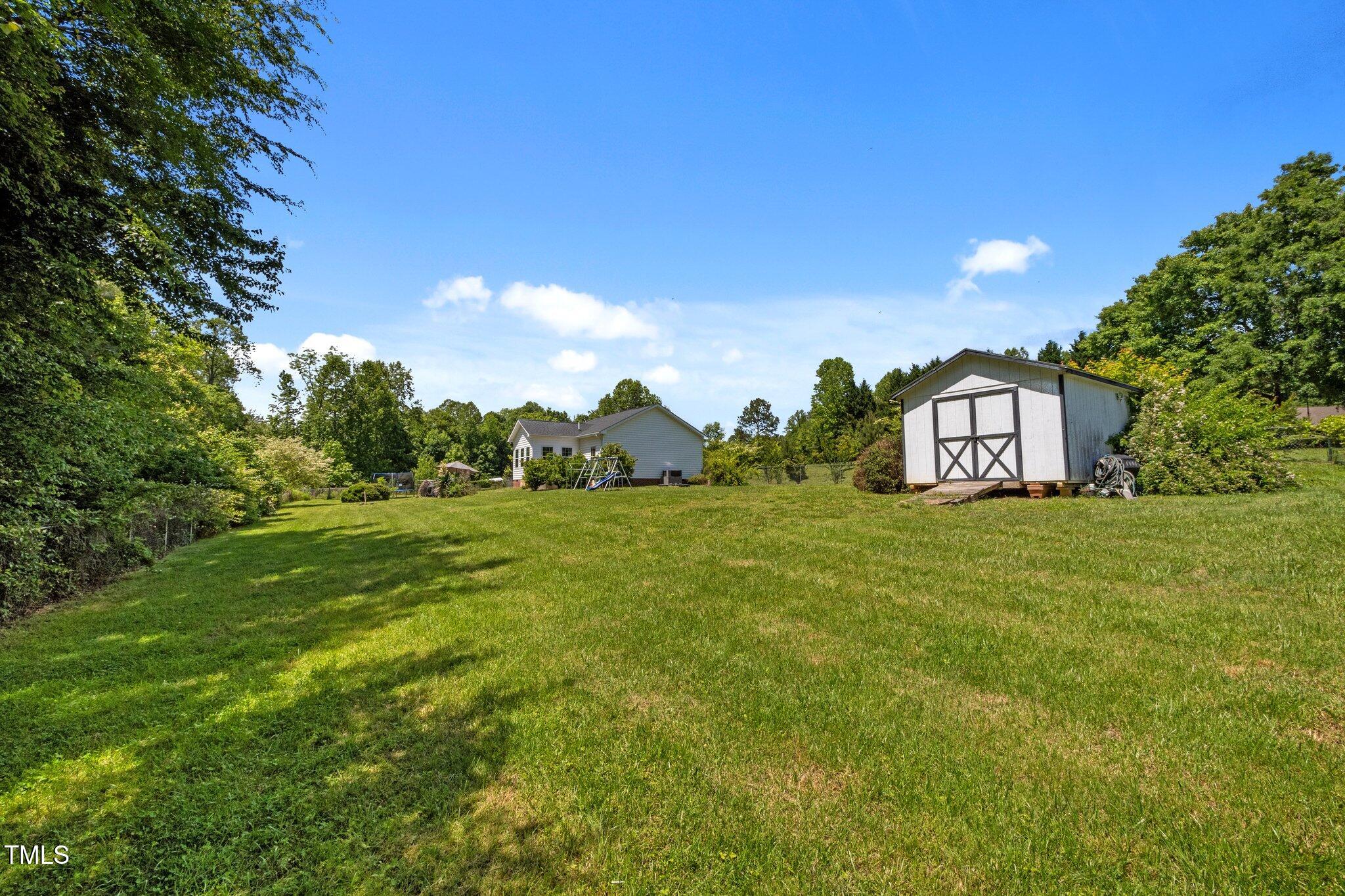 5013 West Pool Road Rougemont, NC 27572 - Photo 25 of 34 a house view with a garden