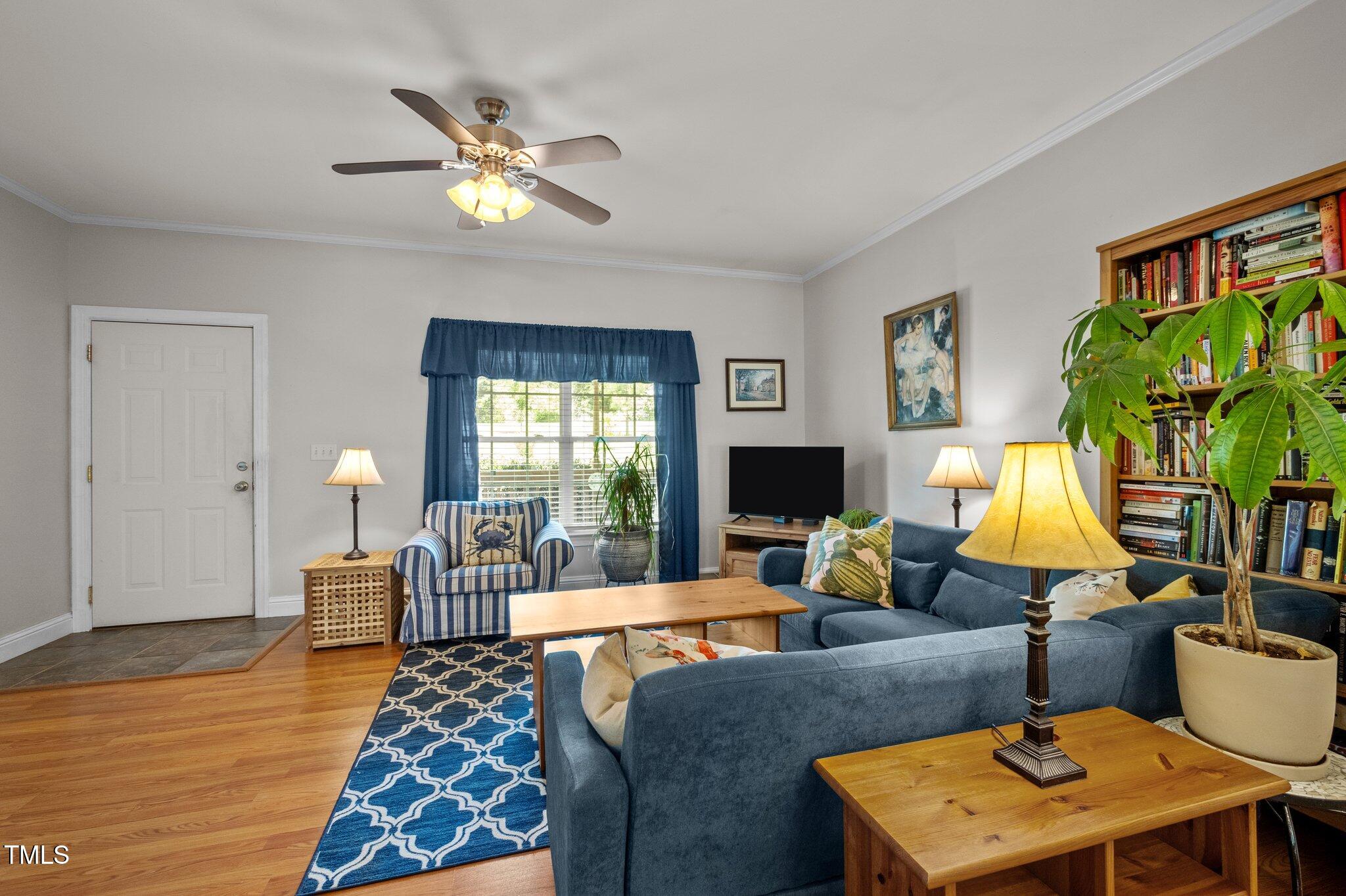 5013 West Pool Road Rougemont, NC 27572 - Photo 6 of 34 a living room with furniture and a lamp