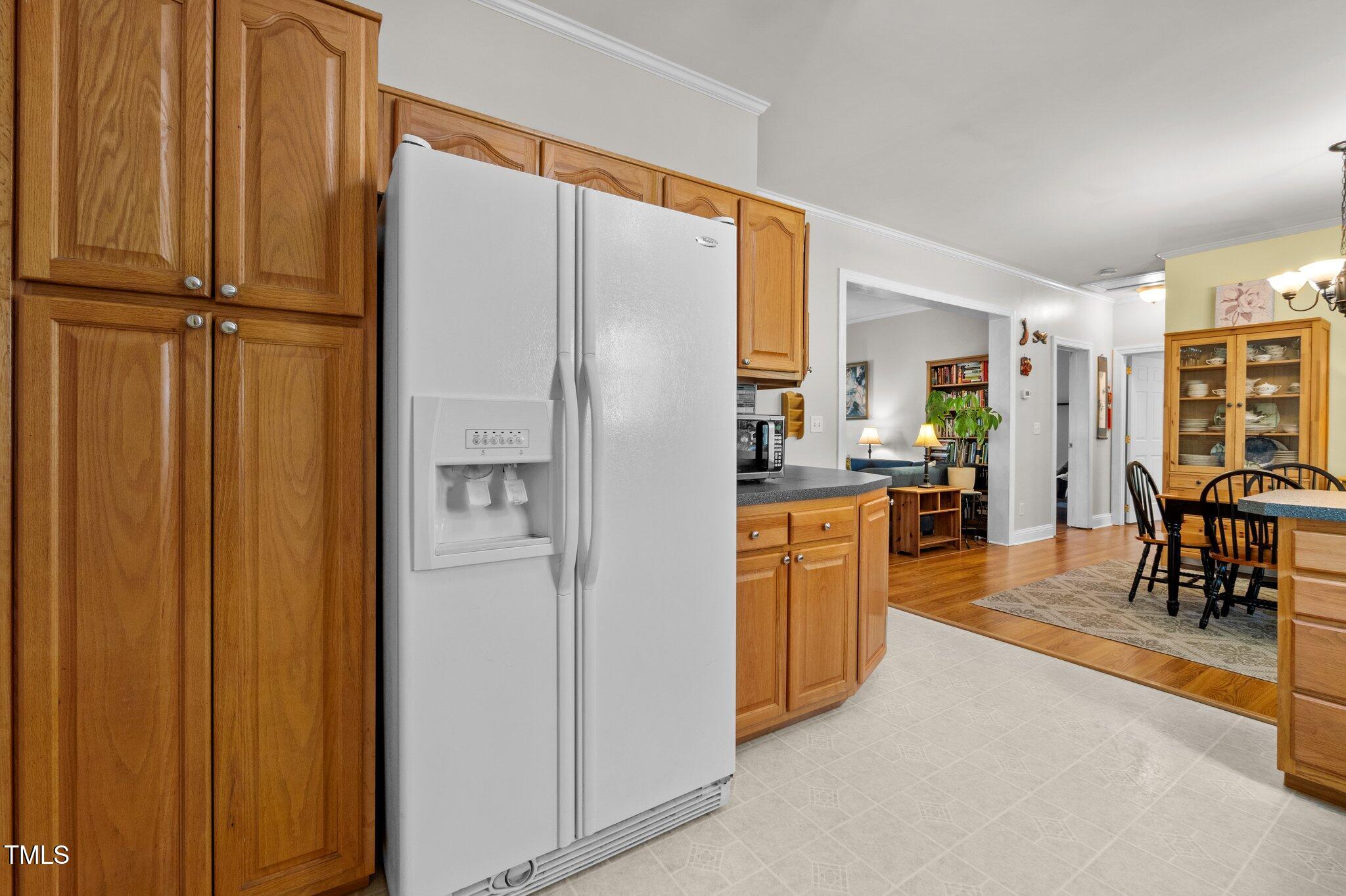 5013 West Pool Road Rougemont, NC 27572 - Photo 10 of 34 a kitchen with stainless steel appliances a refrigerator and cabinets