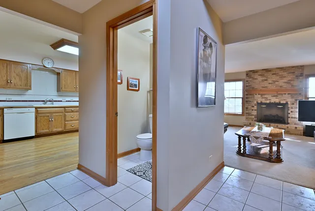 a view of a livingroom with furniture and a kitchen