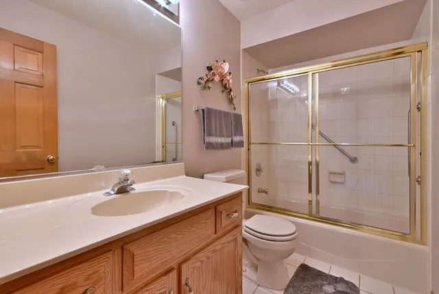 a bedroom with a bed and a desk