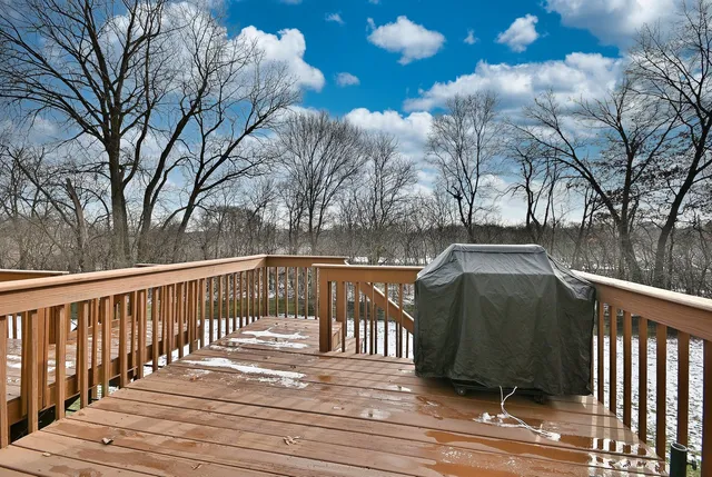 a view of a brick house with large windows