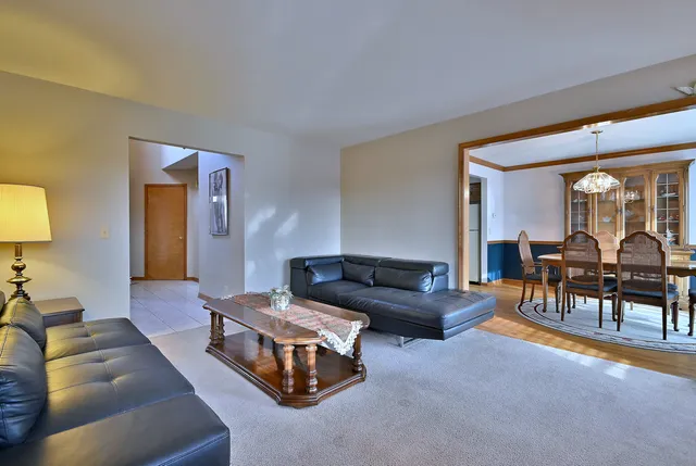 a living room with furniture and a table