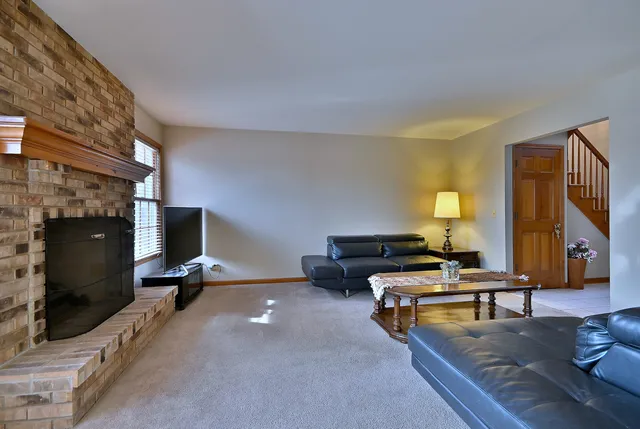 a bedroom with furniture and a flat screen tv