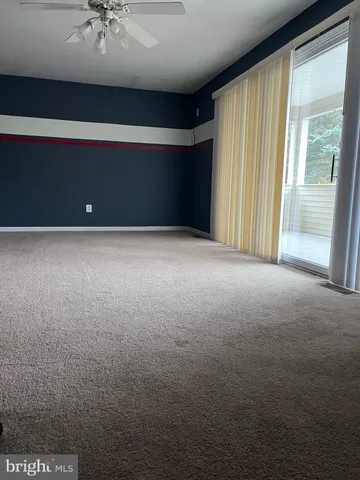 an empty room with closet area
