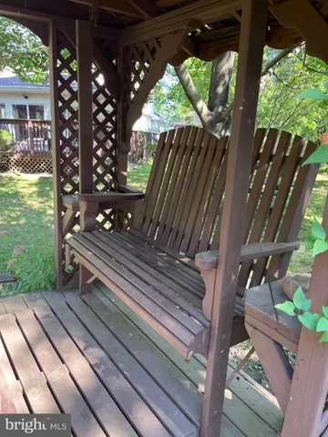 a view of a balcony with wooden floor
