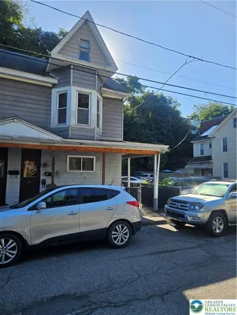 a car parked in front of a house