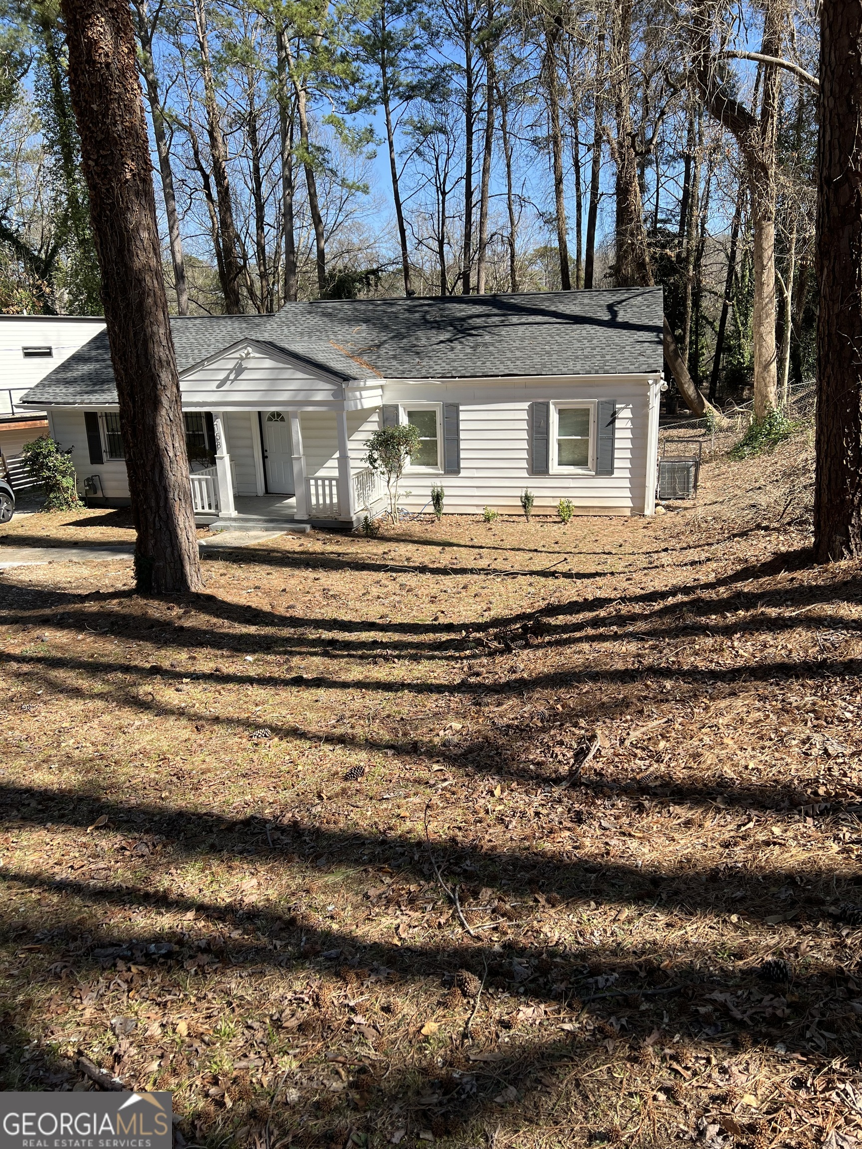 a front view of a house with a ocean view