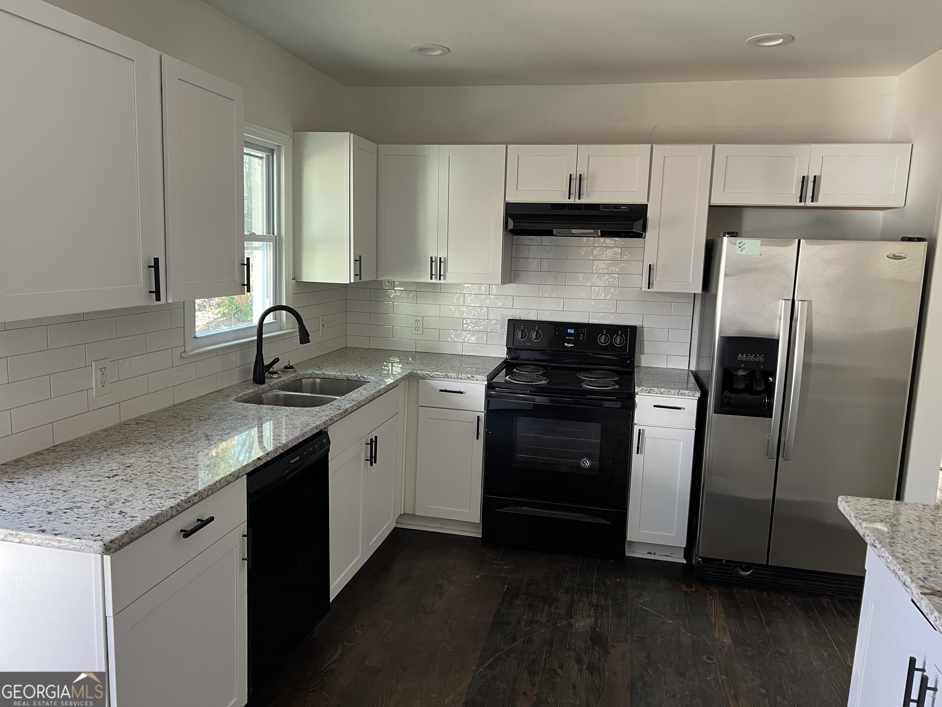 2158 Beecher Road Southwest, Unit A Atlanta, GA 30311 - Photo 7 of 20 a kitchen with a sink stove and refrigerator