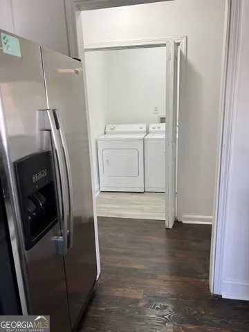 a view of a storage and utility room with washer and dryer
