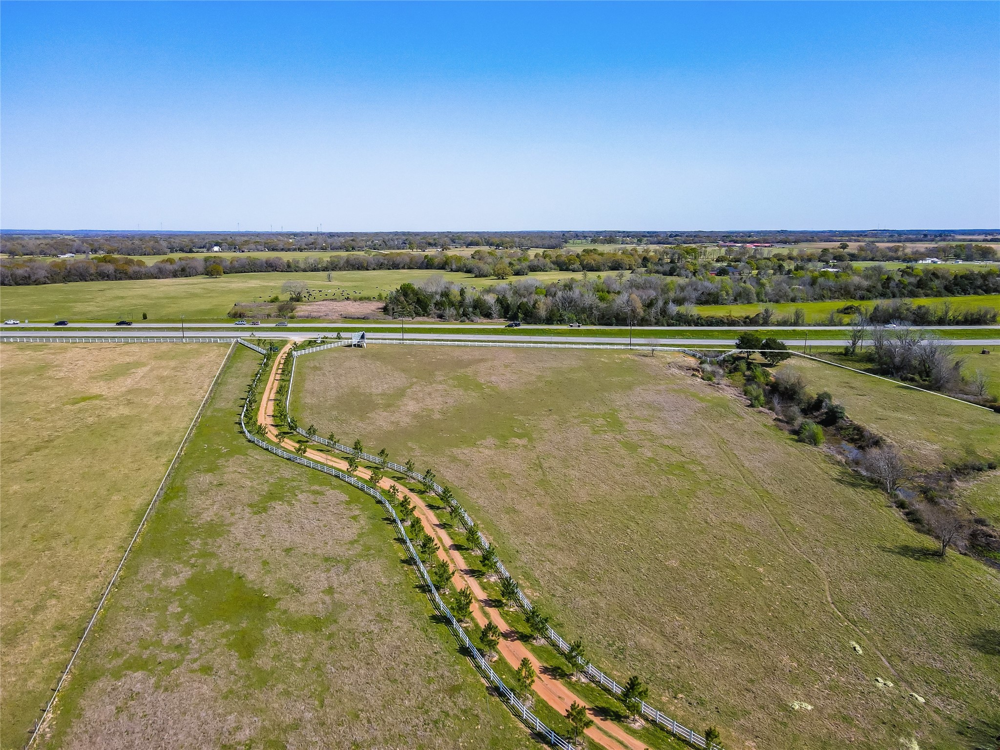 52825 Highway 290 Hempstead, TX 77445 - Photo 4 of 6 a view of a lake with a city