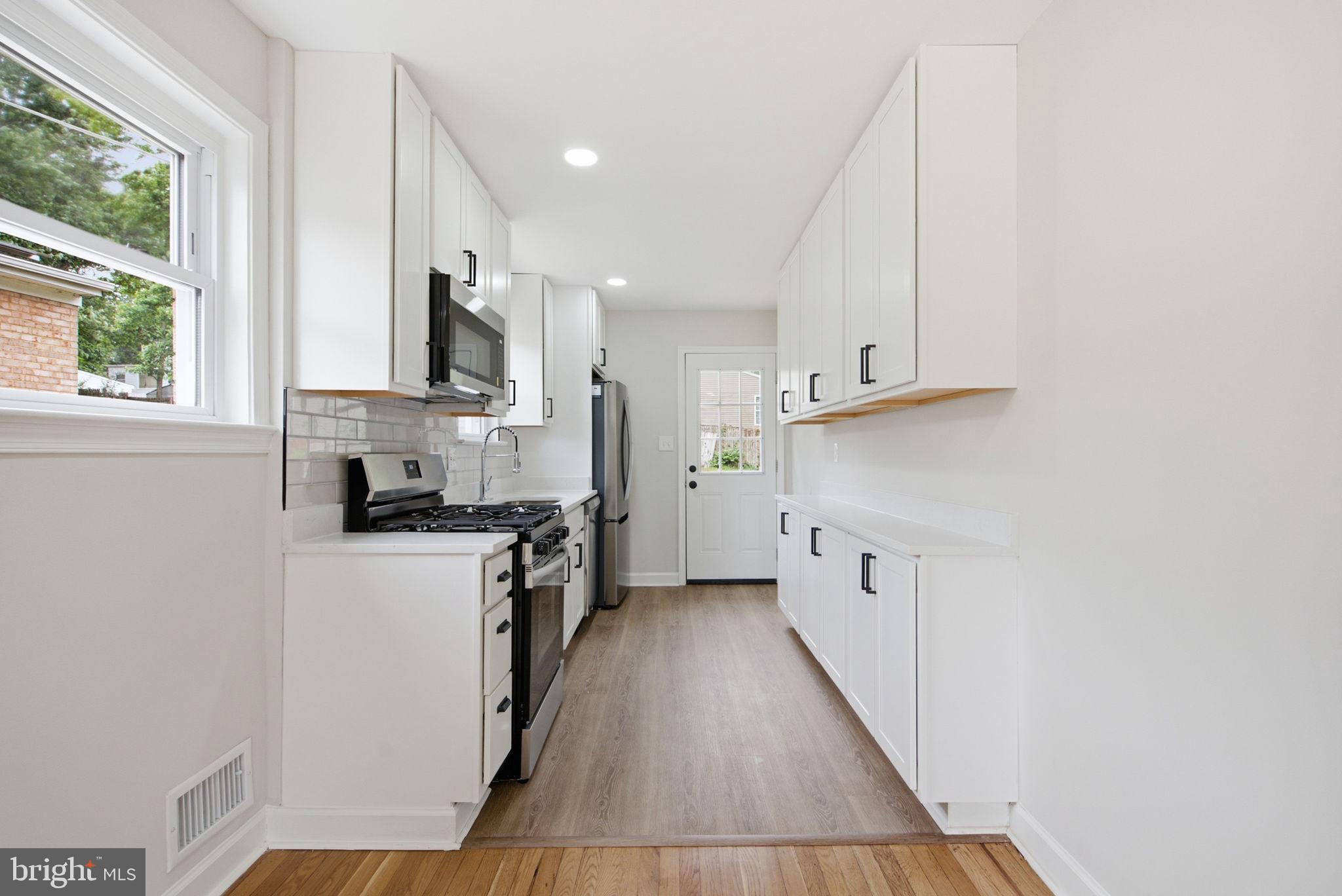 6615 Valley Park Road Capitol Heights, MD 20743 - Photo 6 of 25 Sleek, modern kitchen with natural light.