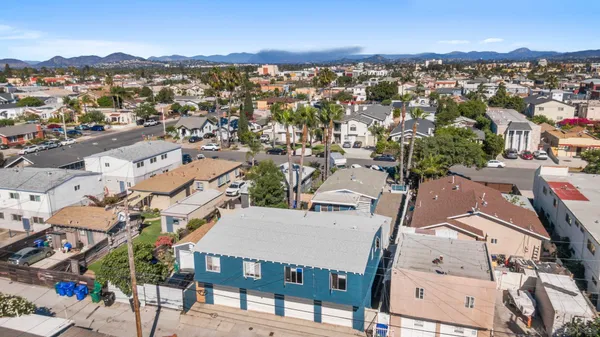 an aerial view of residential houses with outdoor space