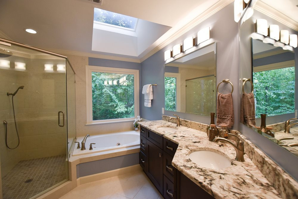 9004 Enfield Court Raleigh, NC 27615 - Photo 19 of 30 Updated Master Bath w/tile flr, granite vanity w/double sinks, jetted tub, lg tiled corner shower, crown molding, skylight & modern light fixtures. Master Bath/Spa