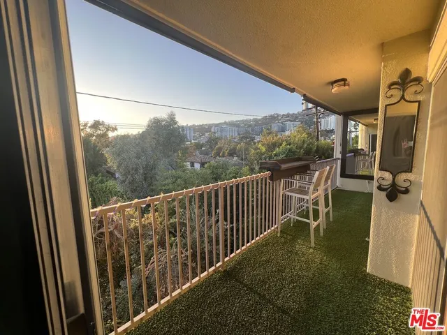 a view of balcony with furniture