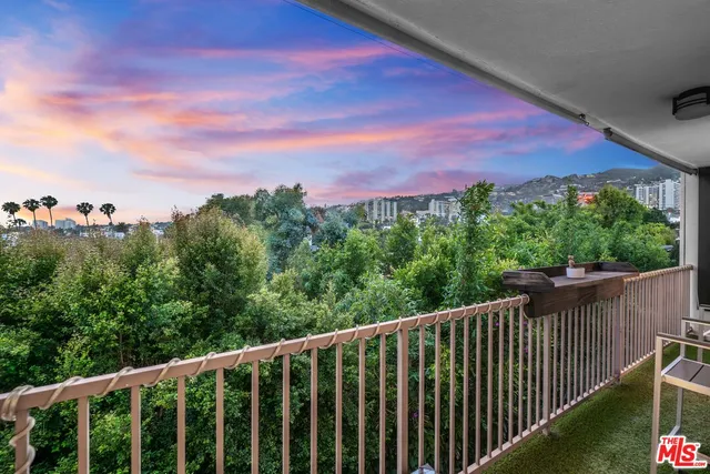 a balcony with an outdoor space