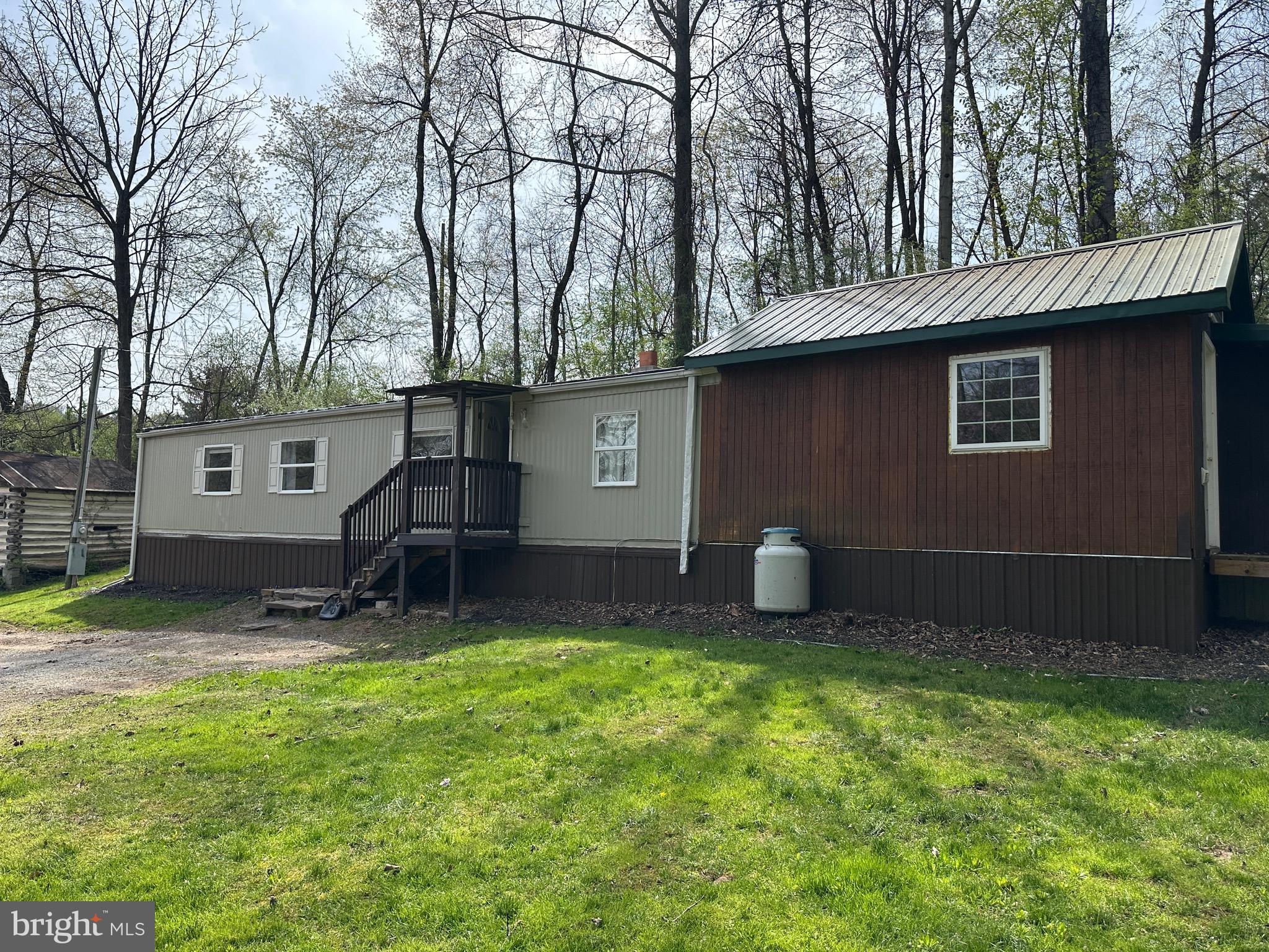 a house view with a backyard space