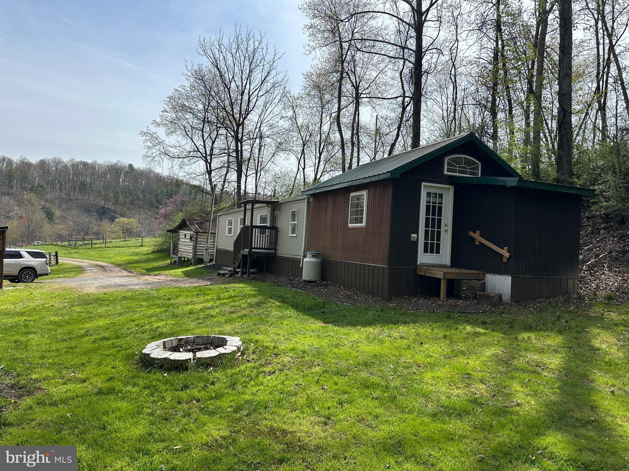 2084 Silvers Road Berkeley Springs, WV 25411 - Photo 17 of 31 a view of a house with backyard and garden