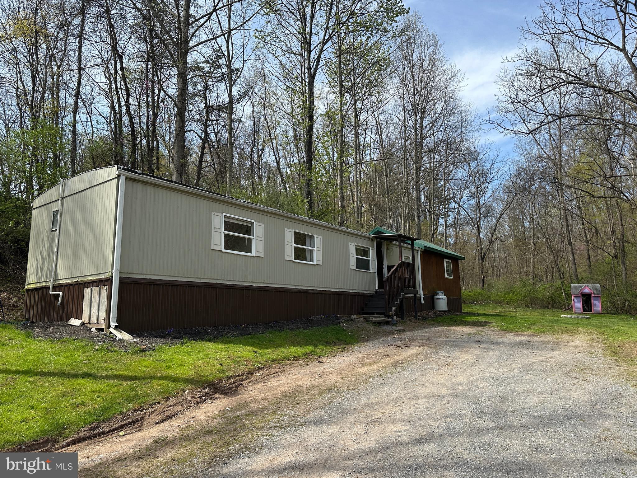 2084 Silvers Road Berkeley Springs, WV 25411 - Photo 20 of 31 a front view of a house with a yard