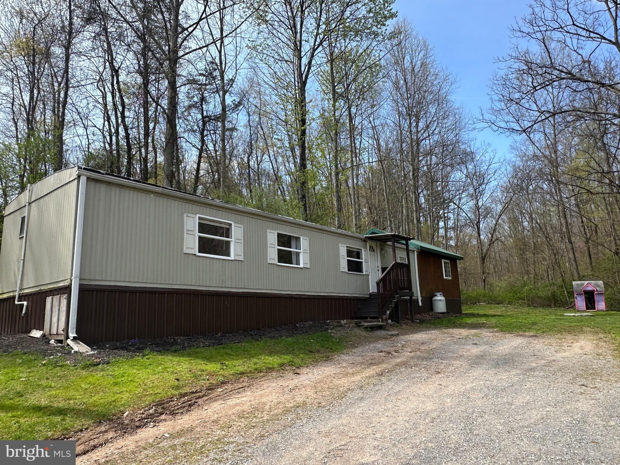 2084 Silvers Road Berkeley Springs, WV 25411 - Photo 22 of 31 a house view with a backyard space