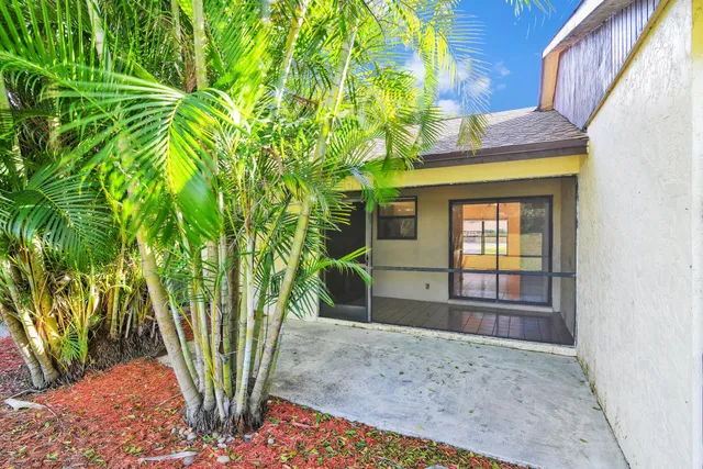 a view of a house with a tree