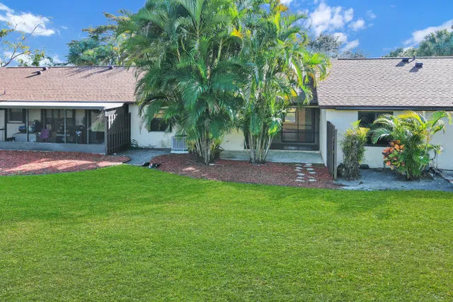 a view of a backyard with a garden and plants