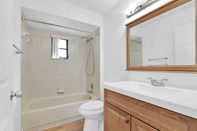a bathroom with a sink a toilet and a bathtub